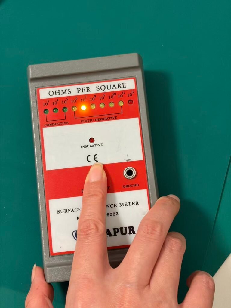 ESD mat resistance testing with surface resistance meter for electronics manufacturing
