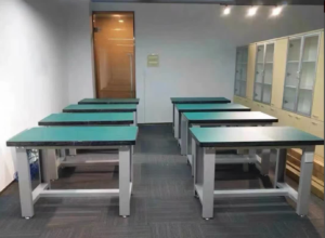 Blue ESD bench mats installed throughout an electronics manufacturing facility.