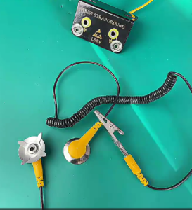Ground cord connected to an ESD mat during grounding continuity verification.