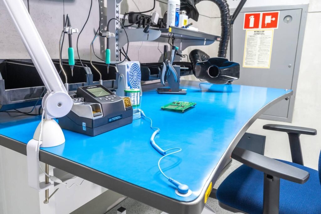 Static dissipative mat installed on an electronics assembly workbench
