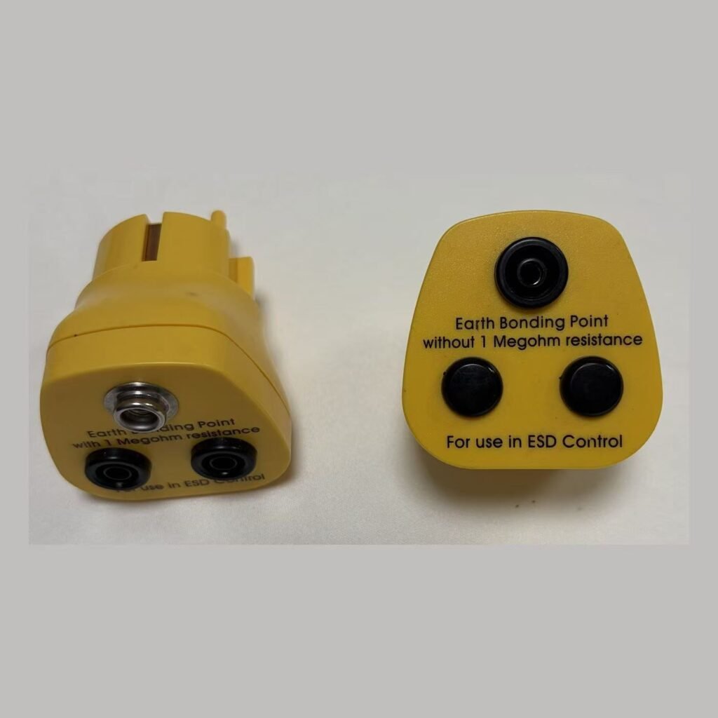 Earth bonding plugs with and without 1 megohm resistance side by side, showing different socket configurations